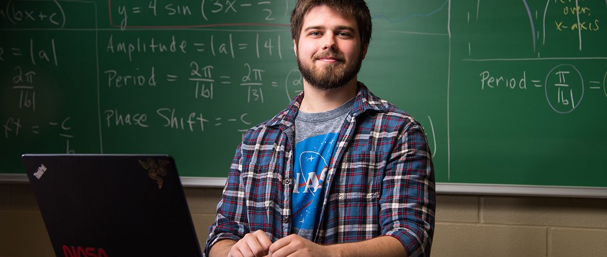 Math student at chalkboard