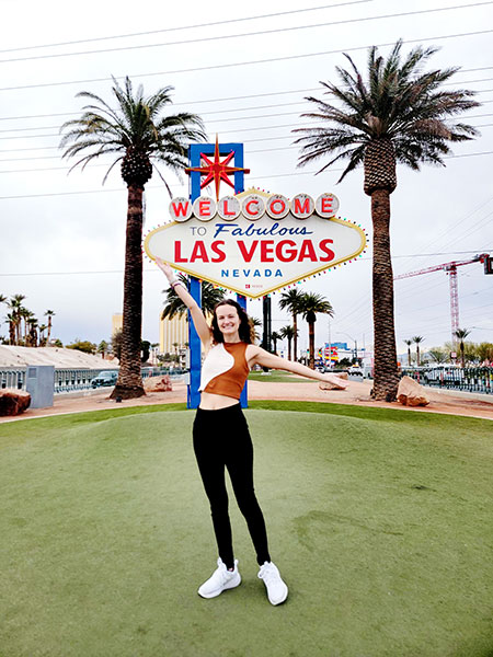 Mayo celebrates at the famous "Welcome to Fabulous Las Vegas" sign.