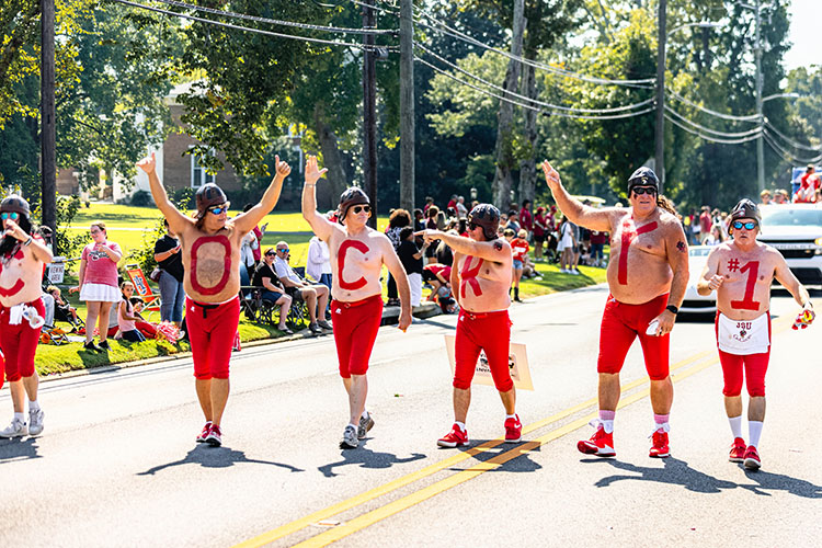 Elite Lettermen march in the Jax State Homecoming parade