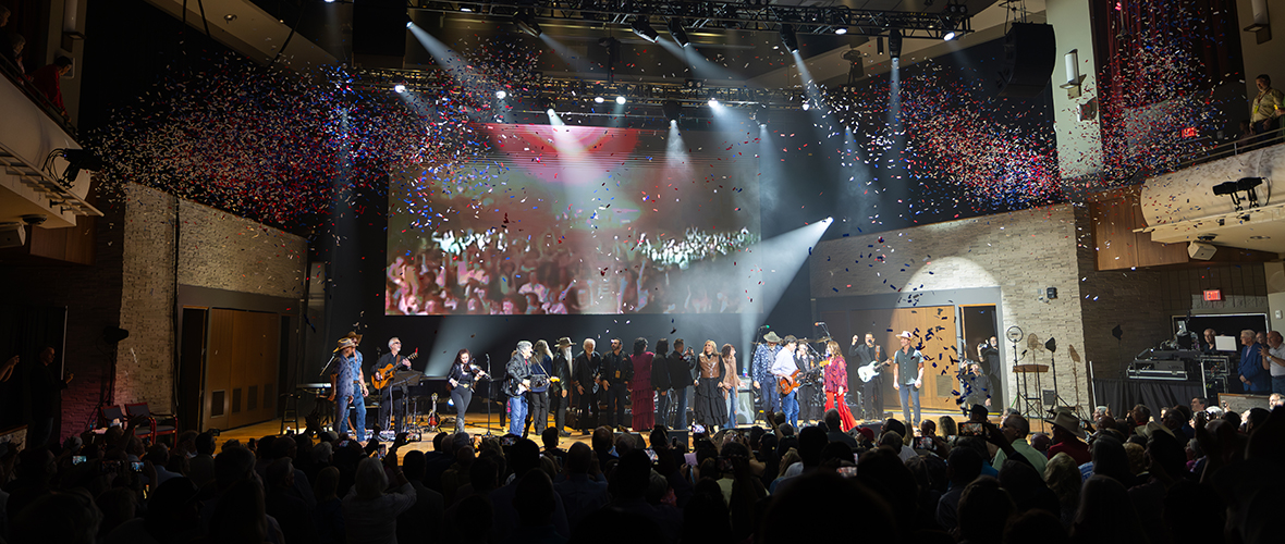 Confetti falls over gusts and artists at the ROC grand opening