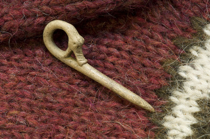 A Norse dragon bone pin researchers have uncovered on site. 