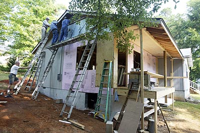 Volunteers at work on Coach DeBoy's home.