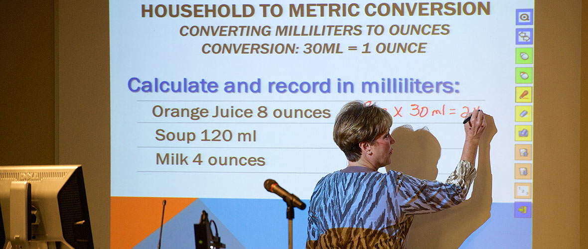 Instructor teaching about metric conversions