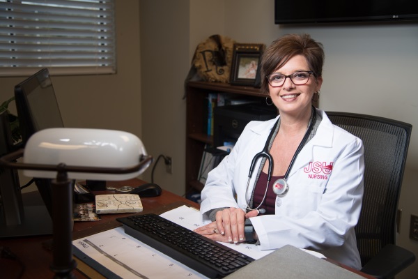 female nursing candidate at desk