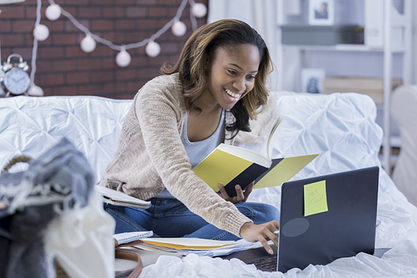 girl studying online in room