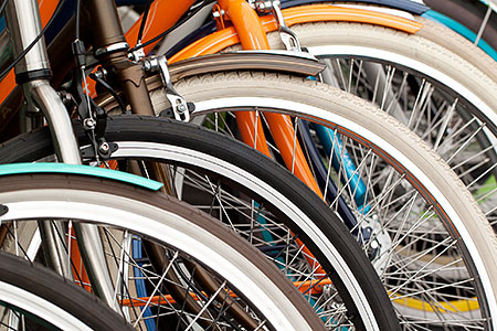 bikes lined up on a bike rack