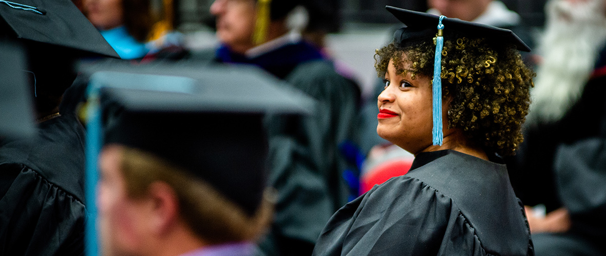 Graduate student at hooding ceremony