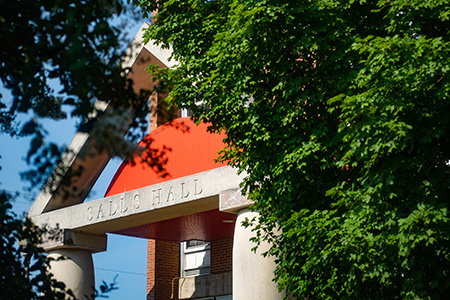 The entrance to Salls Hall, framed by trees