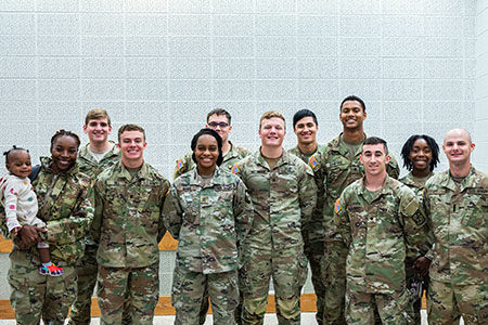 Military service members at a Veteran's Day Program