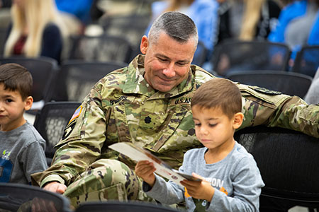 Military parent with child