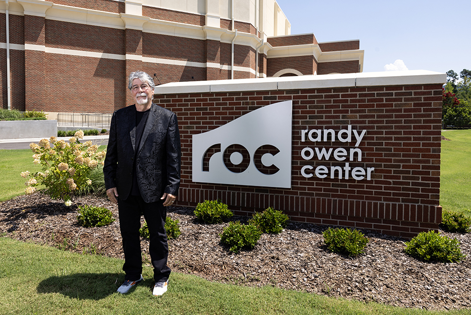 Randy Owen beside ROC sign