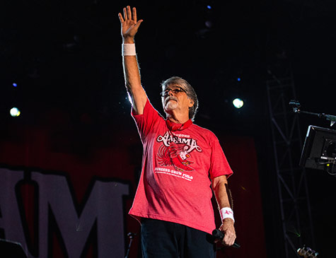 Randy Owen waves to the crowd during the JSU Strong benefit concert in 2018