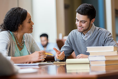 A student meets with his advisor.