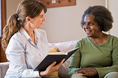 A female social worker attends to a client