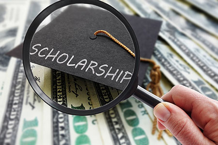Scholarship text over stacks of money