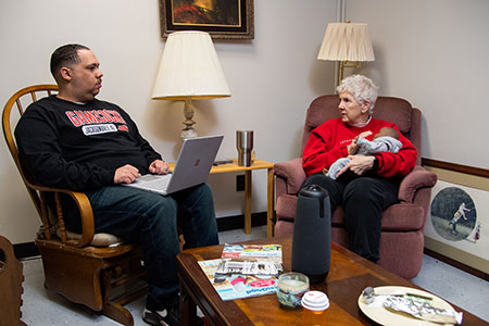 A male social work student participates in a simulation with a JSU faculty member