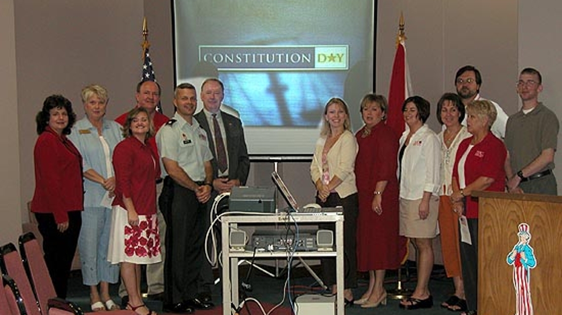 Organizers for the 2005 Constitution Day Program at JSU stand in front of a screen with the text "Constitution Day" showing. 
