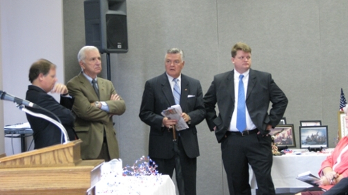 Three of the 2009 Constitution Day Panelists standing with President Meehan.