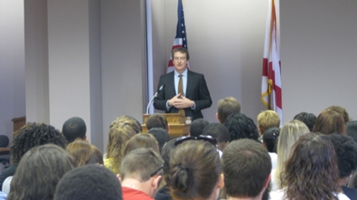 2010 Constitution Day Speaker Stephen Black stands behind a podium speaking to the audience.