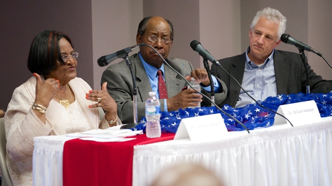 Panelists from the 2015 Constitution Day Celebration sitting at a table as they speak.