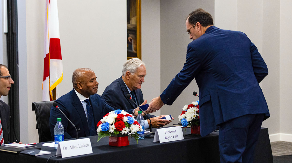 Mr. Thomas Rains, Executive Director, The Judge Frank Johnson Institute thanks the panelists and provides them with a paperweight courtesy of The Judge Frank Johnson Institute. 