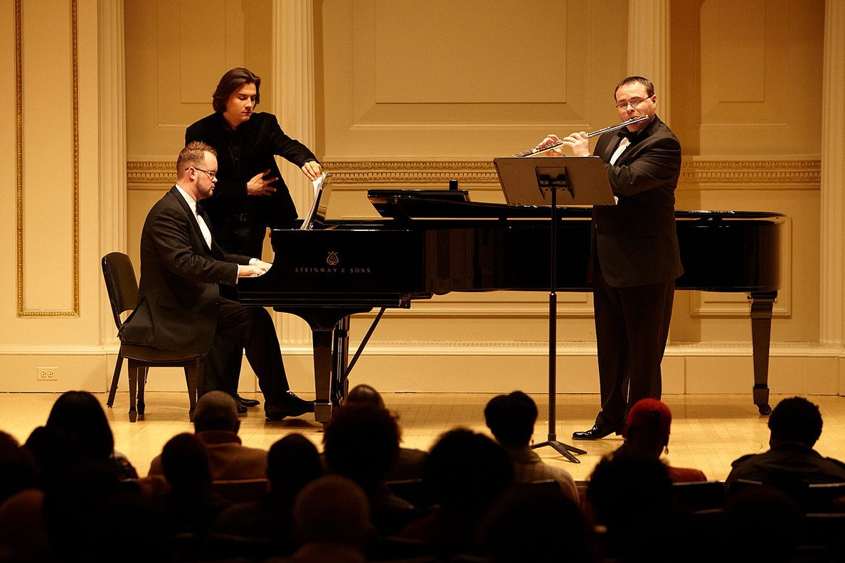 Doctor Jeremy Benson performs on stage at Carnegie Hall