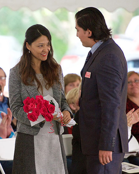 Mendez presents flowers at UN Day Tea to  International House Director Chandni Khadka Walsh