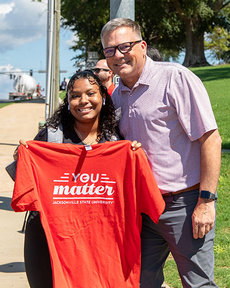 Terry Casey handing out You Matter shirts