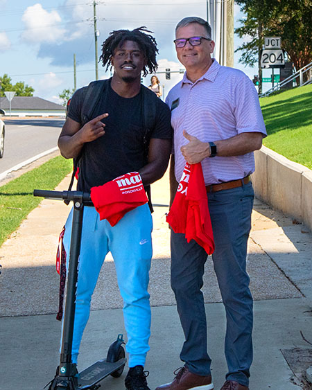 Terry Casey handing out You Matter shirts