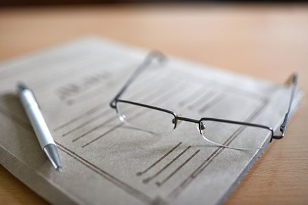 Glasses on top of paper