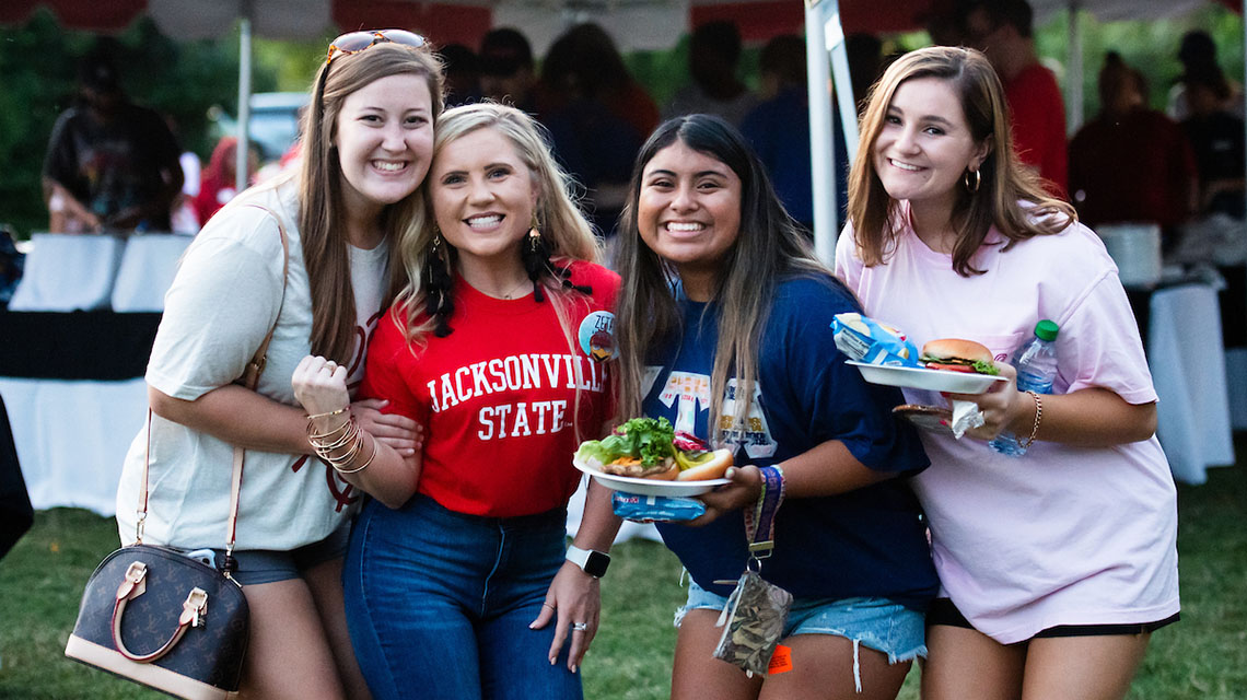 students at a cookout on campus