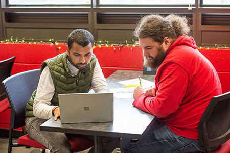 A student being assisted with registering for classes