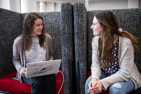 Two girls in the student success center registering for a placement test