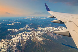 Plane flying over mountains