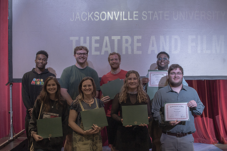 Group of students holding certificates