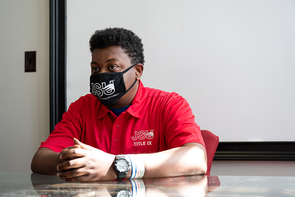 Male Title IX advisor at desk