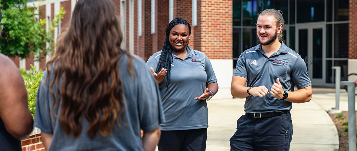 A JSU  Gamecock Guide conducts a campus tour