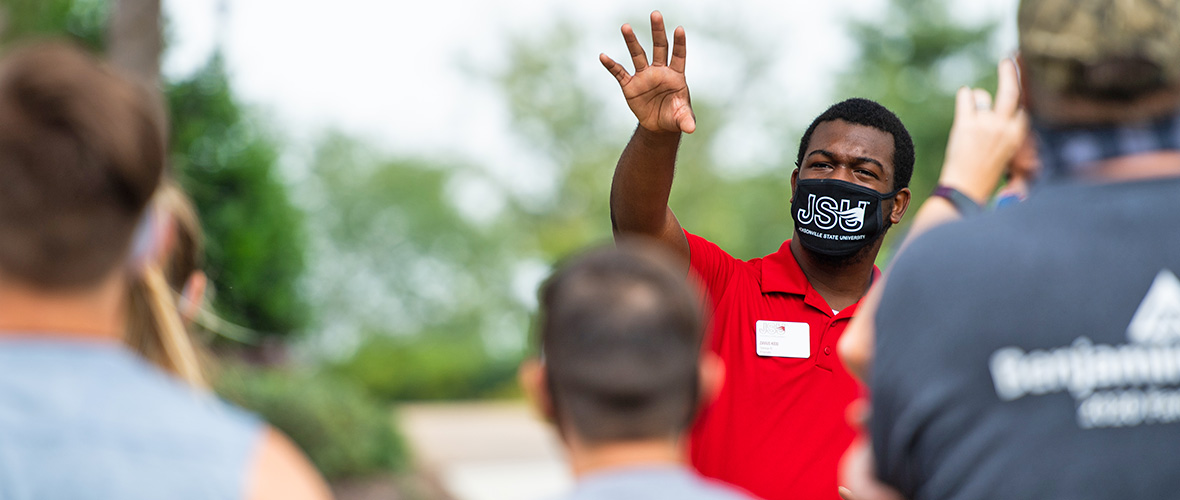 A JSU tour guide shows a group around campus.