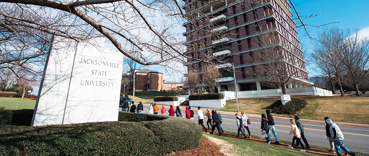 A JSU tour guide shows a group around campus.