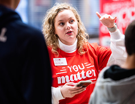 Caely talking to prospective students at Preview Day