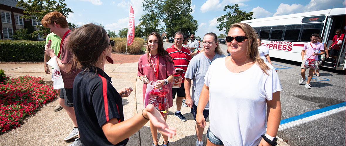A JSU tour guide shows a group around campus.